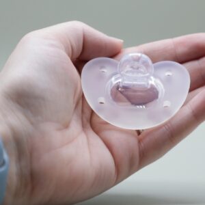 Hand Holding Breathe Pacifier