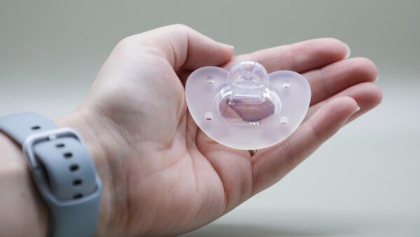 Hand Holding Breathe Pacifier